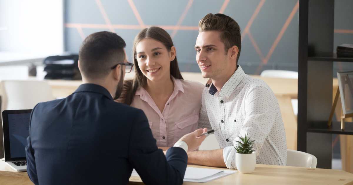 People getting approved for a loan with a car as collateral.