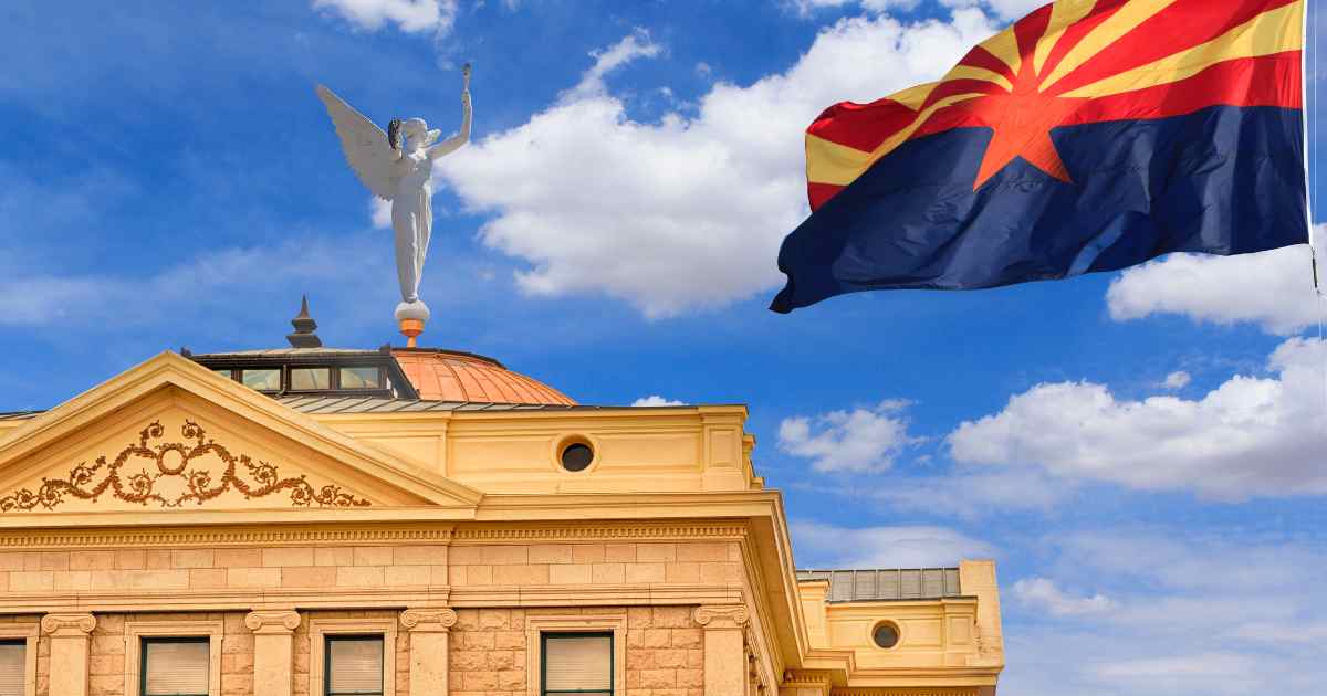 The AZ State Flag flying next to the Capitol Building on West Washington Street in Phoenix