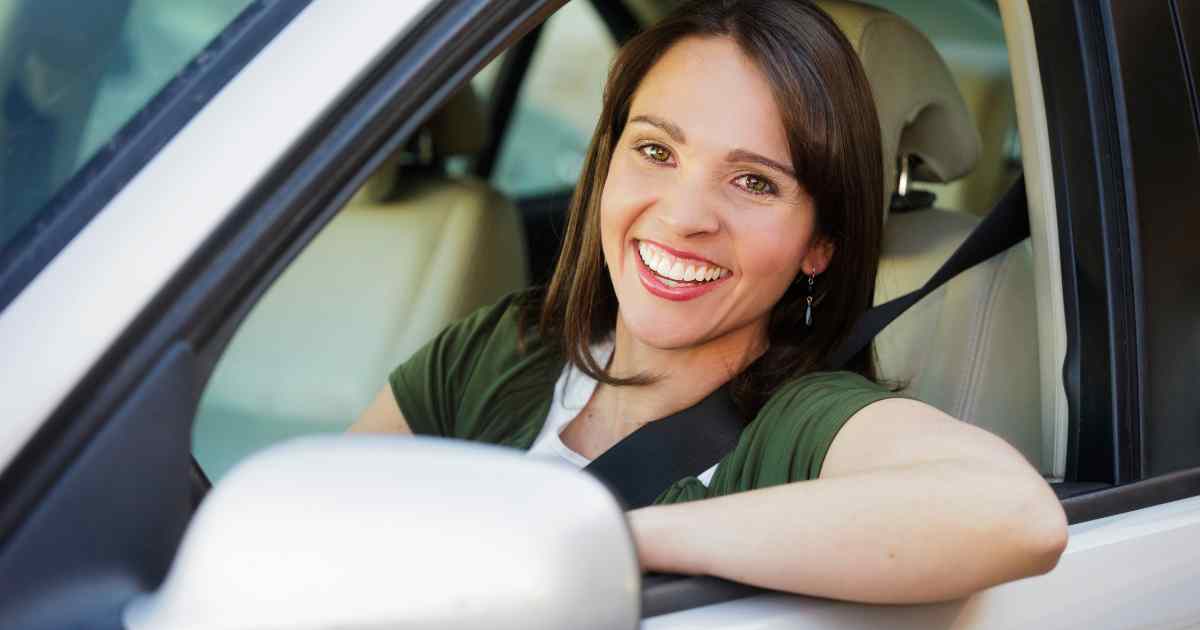 Woman driving on the Pat D'Arco Highway in Rio Rancho, NM.