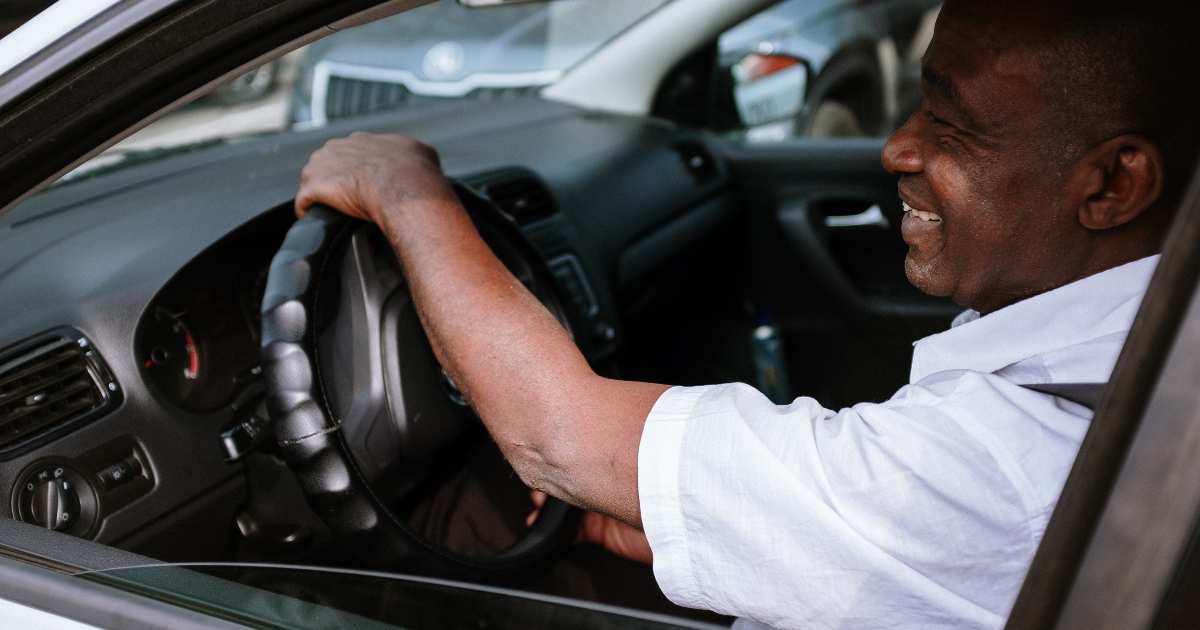 A customer in Greenville driving away after paying off his loan.