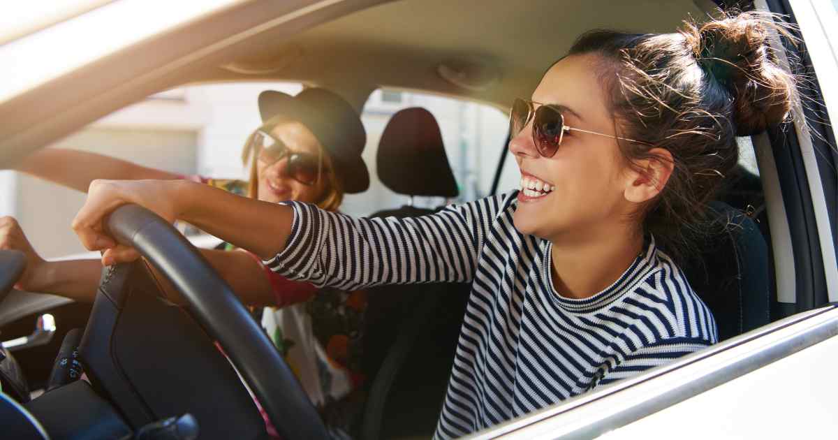 Women driving a vehicle on Highway 99 through Bakersfield.