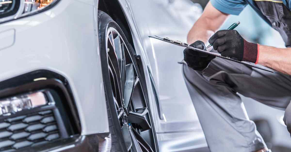 An auto inspector checking out a vehicle condition.