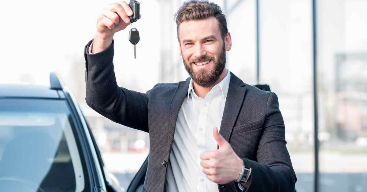 A man holding his keys after approval for an auto equity loan.