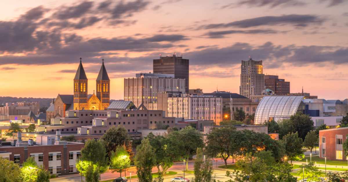 Downtown Akron at dusk with a view of St. Bernard's Church